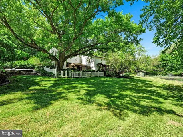 a house with trees in the background