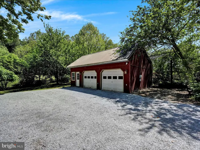 a view of a backyard with swimming pool