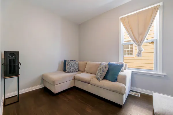 a living room with a couch and a window