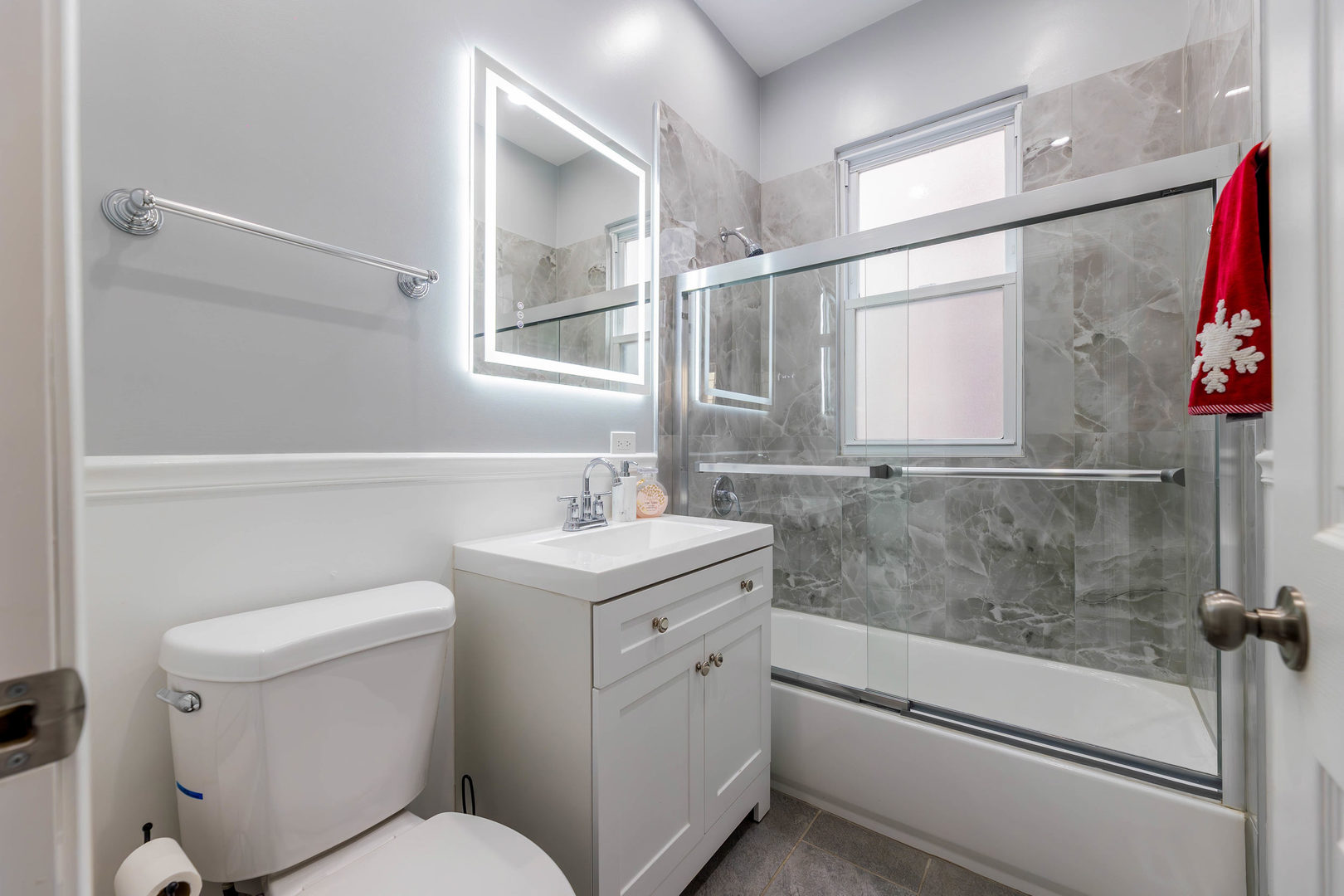 1473 West 73rd Street Chicago, IL 60636 - Photo 12 of 28 a bathroom with a sink a toilet and shower