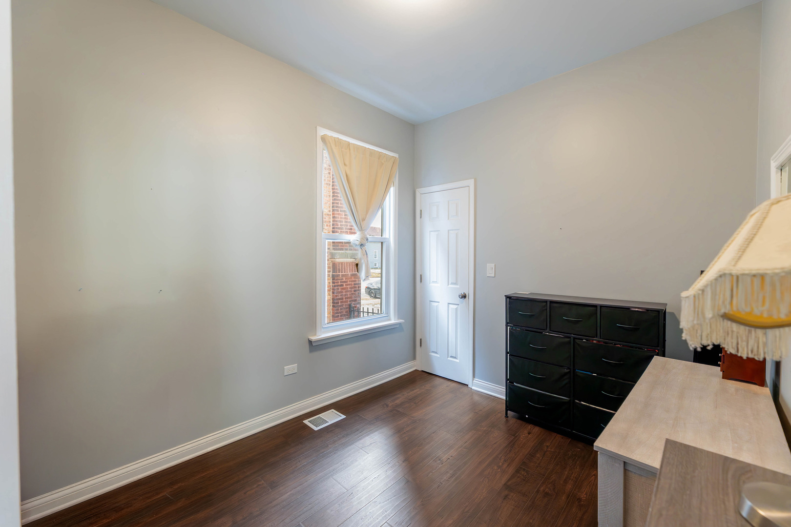 1473 West 73rd Street Chicago, IL 60636 - Photo 13 of 28 a view of an empty room with wooden floor and a window
