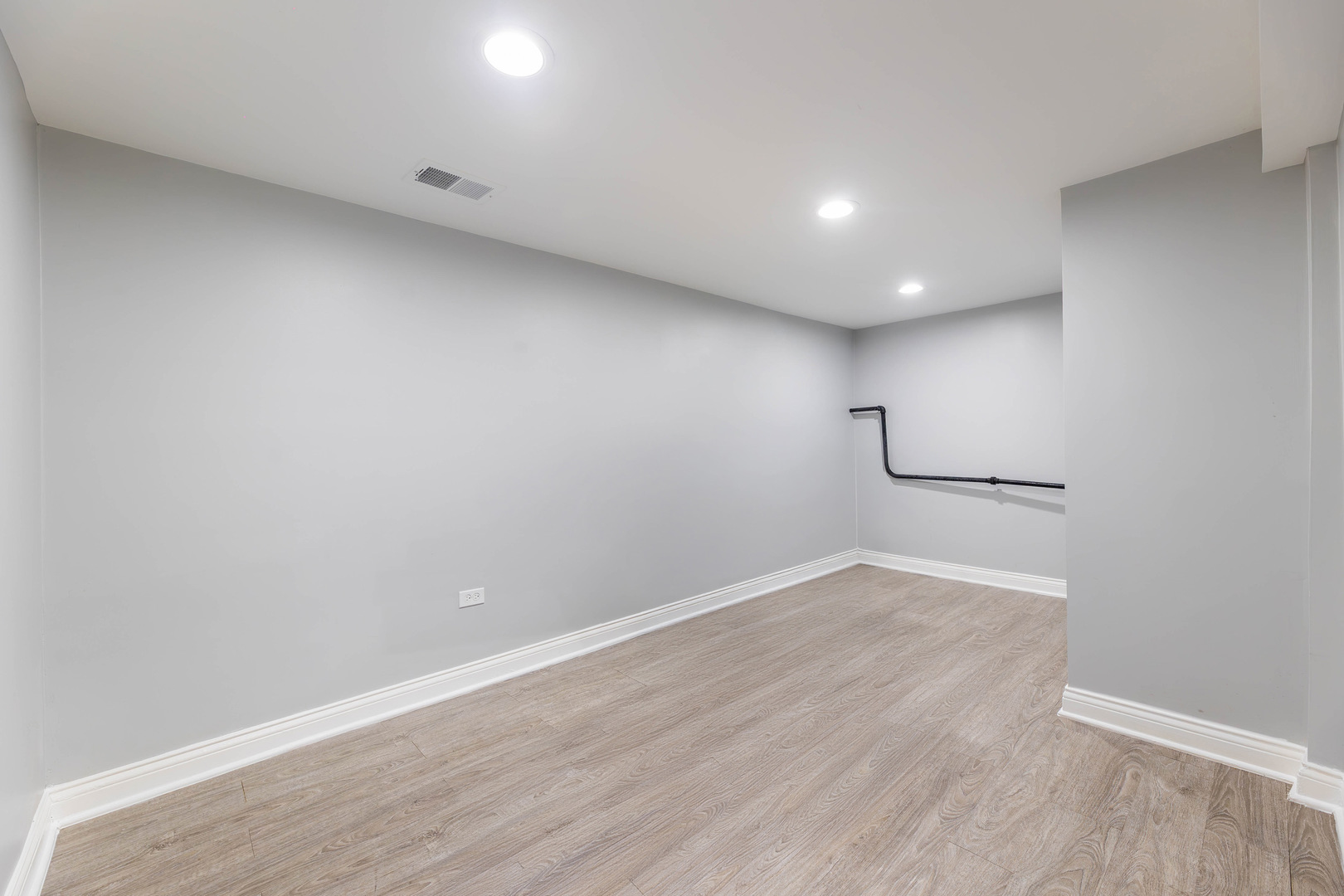 1473 West 73rd Street Chicago, IL 60636 - Photo 19 of 28 an empty room with wooden floor and windows