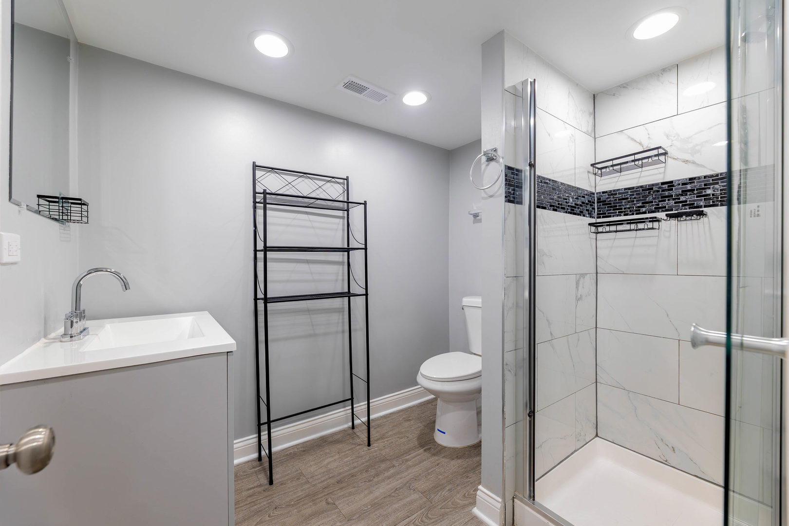 1473 West 73rd Street Chicago, IL 60636 - Photo 22 of 28 a bathroom with a toilet sink and shower