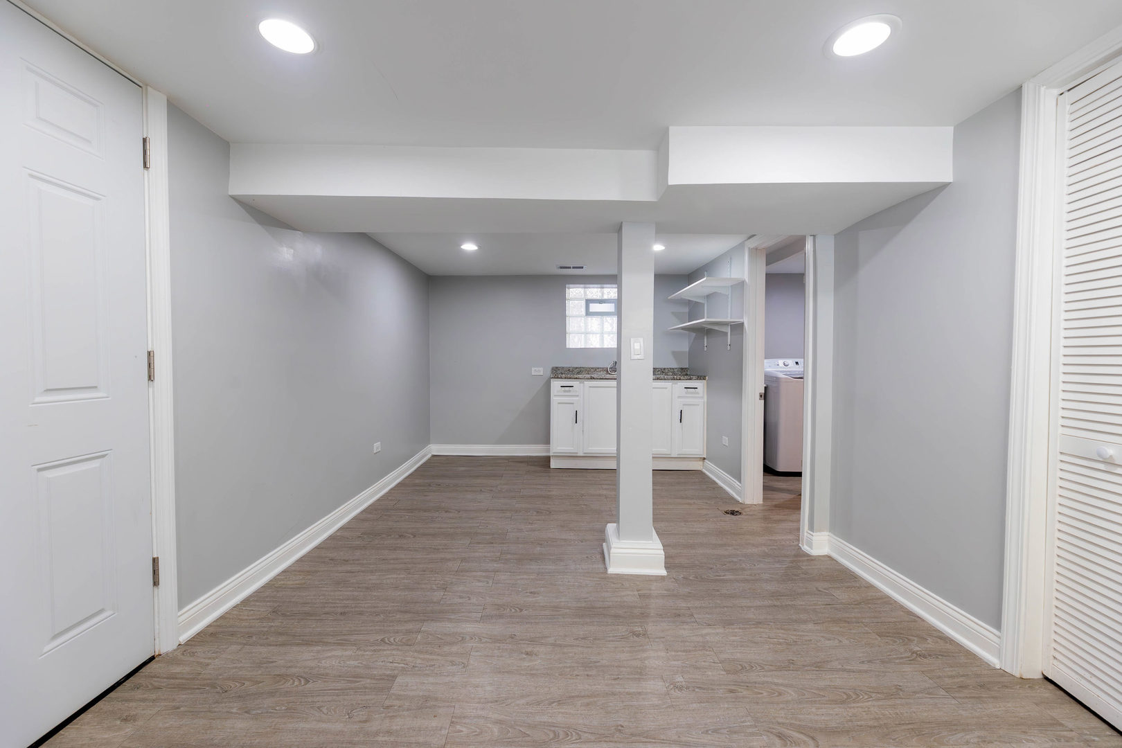 1473 West 73rd Street Chicago, IL 60636 - Photo 23 of 28 wooden floor in an empty room with a kitchen