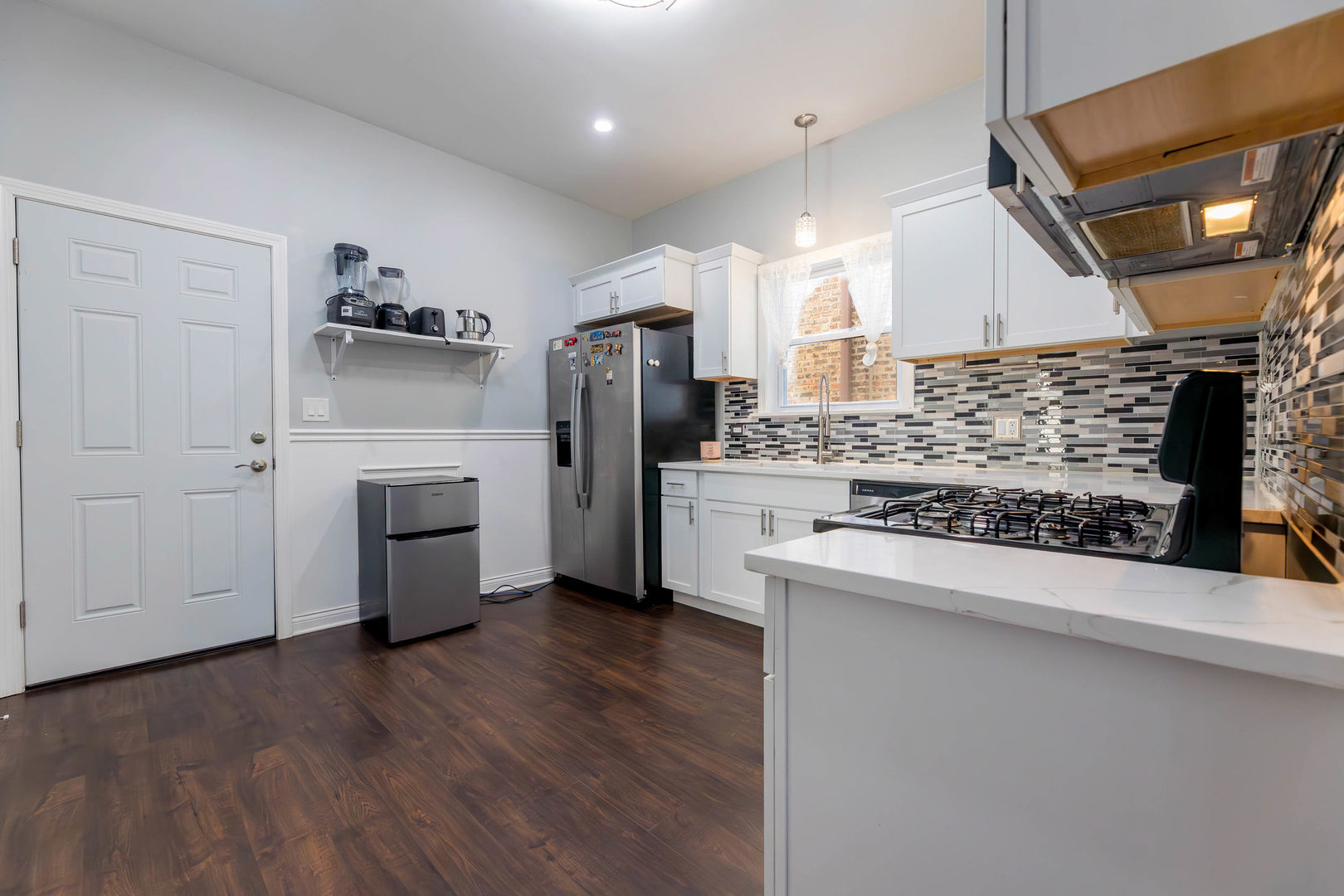 1473 West 73rd Street Chicago, IL 60636 - Photo 10 of 28 a kitchen with refrigerator and cabinets