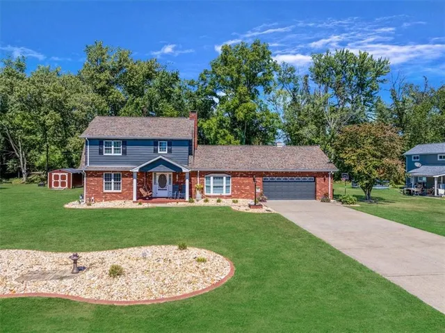front view of a house with a garden