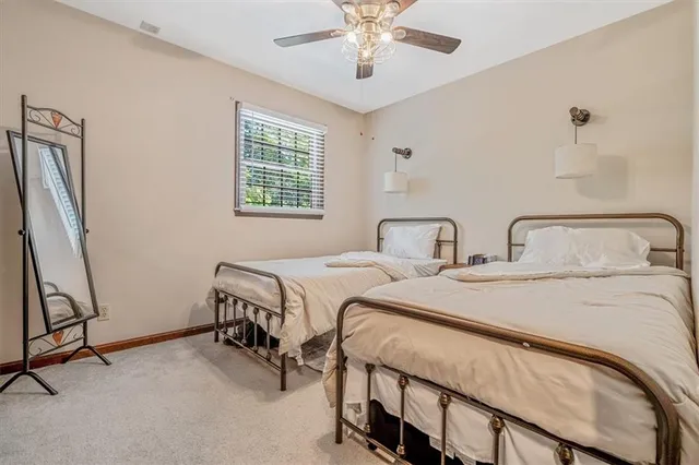 a view of a bedroom with windows