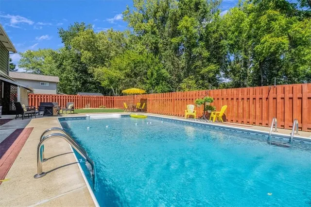 a view of a house with a backyard porch and sitting area