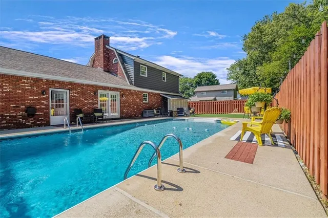 a backyard of a house with outdoor seating