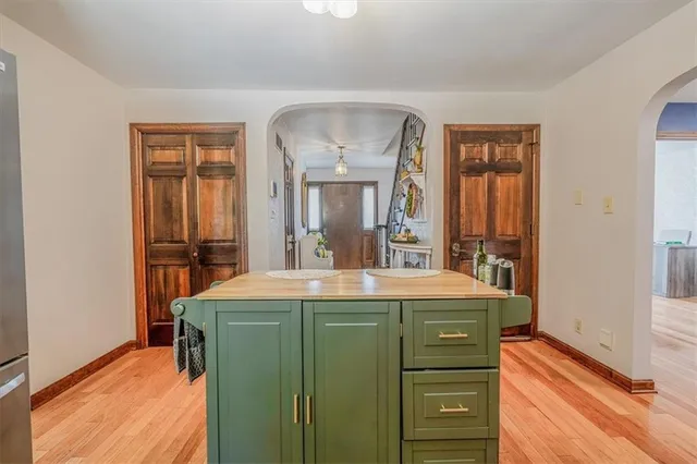 a kitchen with stainless steel appliances granite countertop a stove and a refrigerator
