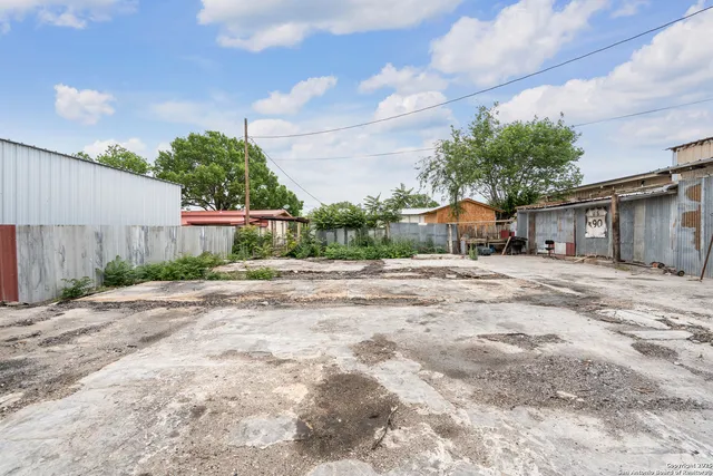 an aerial view of a houses with yard