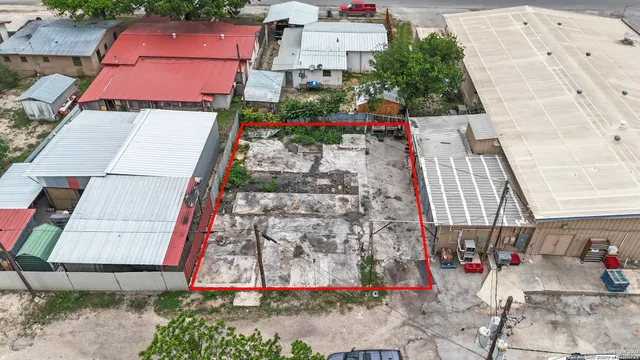 an aerial view of multiple houses with outdoor space