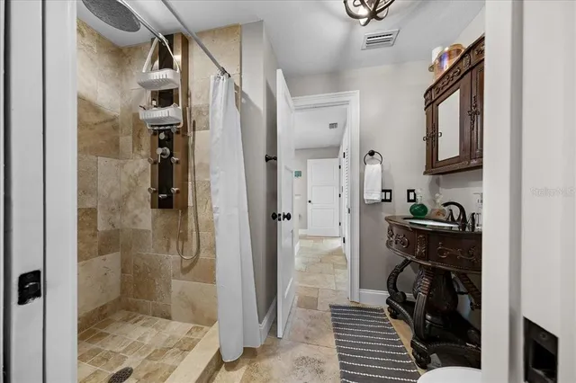 a living room with granite countertop furniture and a large mirror