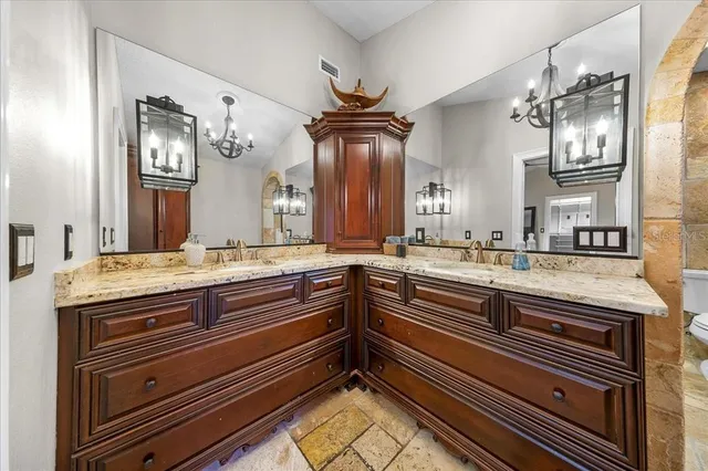 a view of a livingroom with a staircase and a ceiling fan