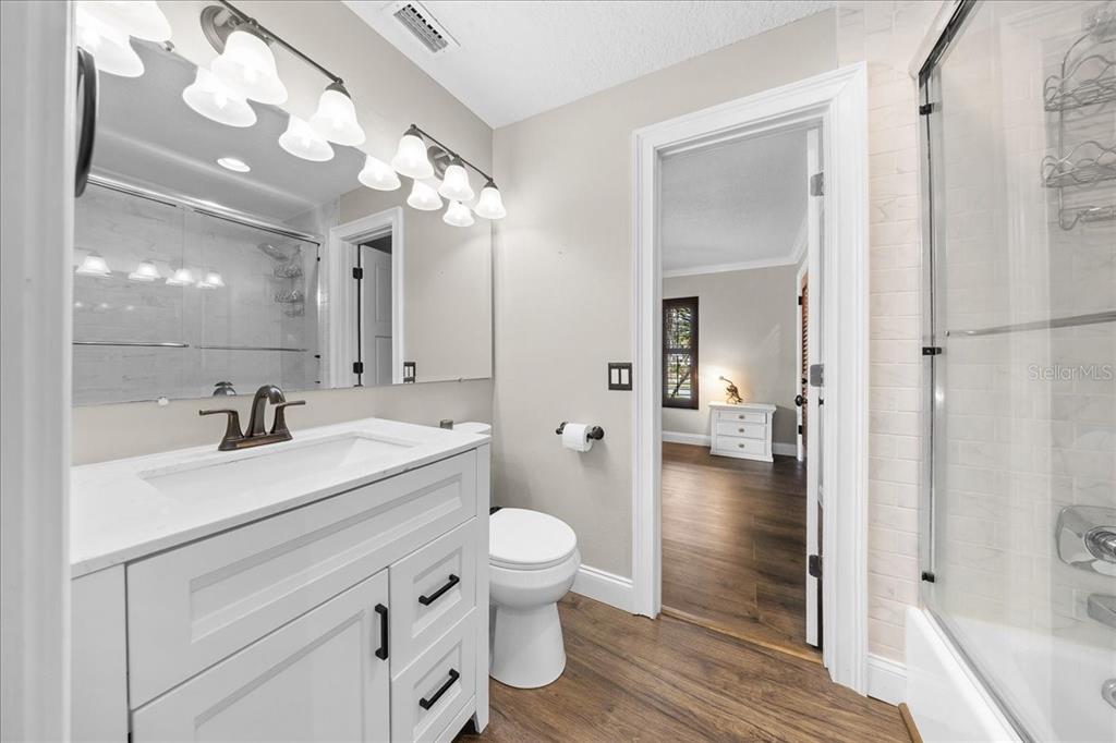 452 Southeast Paradise Point Road Crystal River, FL 34429 - Photo 21 of 83 a bathroom with a sink a toilet and shower a mirror