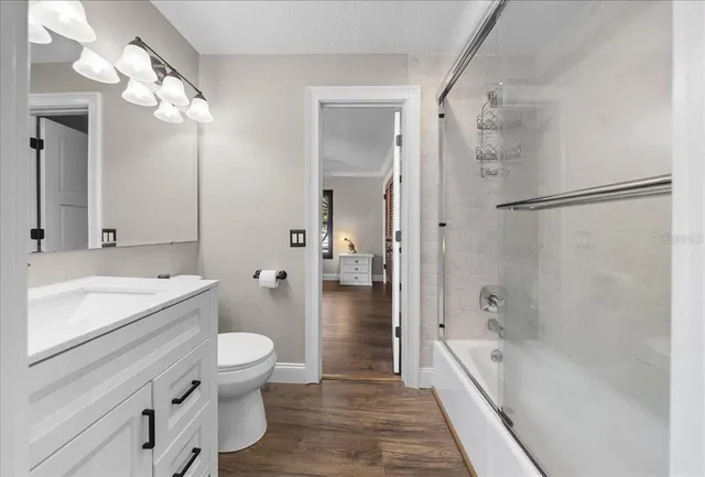 a living room with furniture and white walls