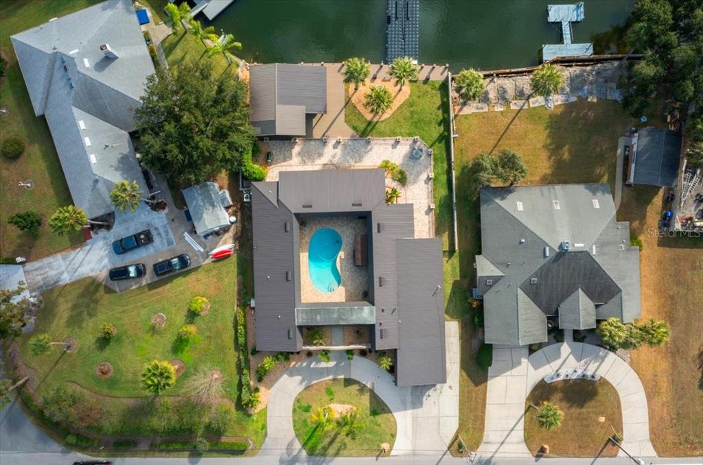 452 Southeast Paradise Point Road Crystal River, FL 34429 - Photo 3 of 83 an aerial view of a house with swimming pool