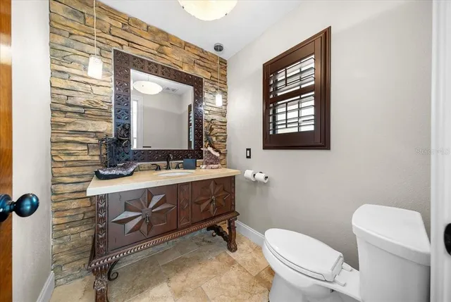 a view of a swimming pool with outdoor seating