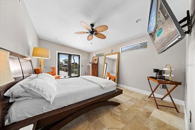 a view of a kitchen with dining area a sink and a refrigerator