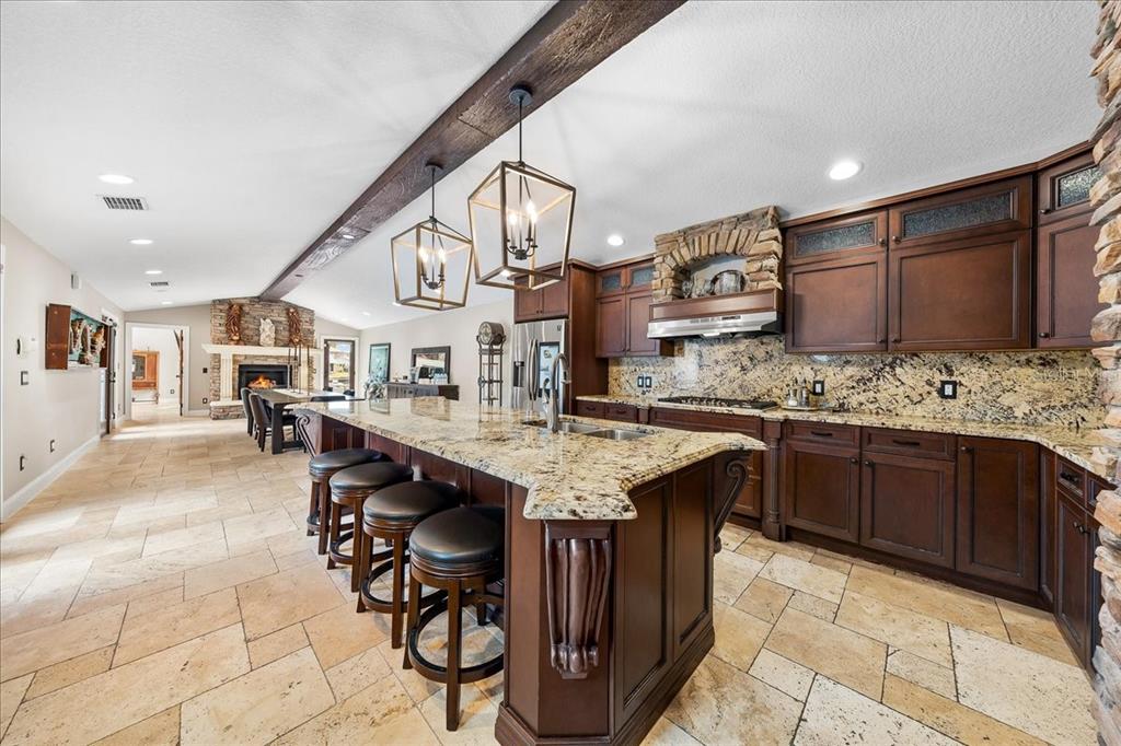 452 Southeast Paradise Point Road Crystal River, FL 34429 - Photo 51 of 83 a kitchen with stainless steel appliances granite countertop a sink and cabinets