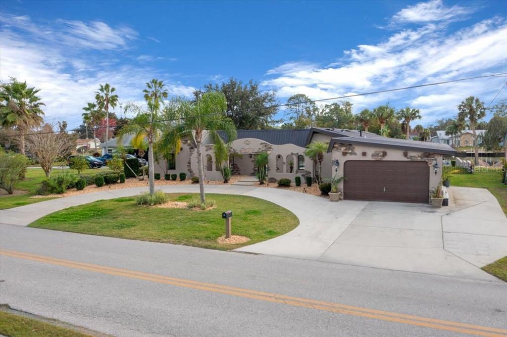 452 Southeast Paradise Point Road Crystal River, FL 34429 - Photo 76 of 83 front view of a house with a yard
