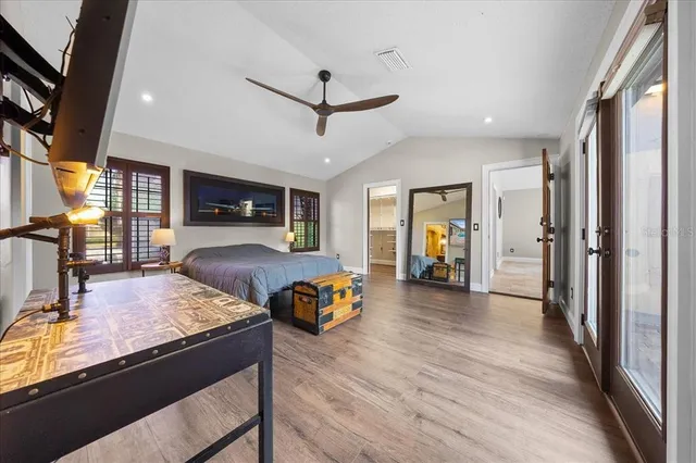 a view of livingroom with kitchen furniture and a ceiling fan