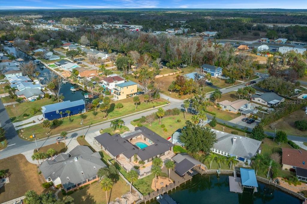 452 Southeast Paradise Point Road Crystal River, FL 34429 - Photo 82 of 83 an aerial view of residential houses with outdoor space