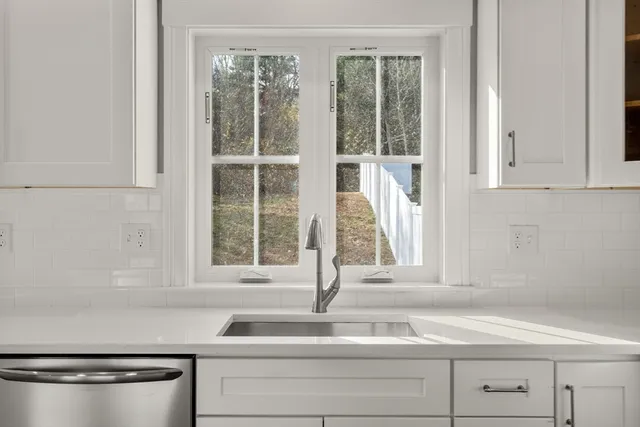 a bathroom with a sink toilet and mirror