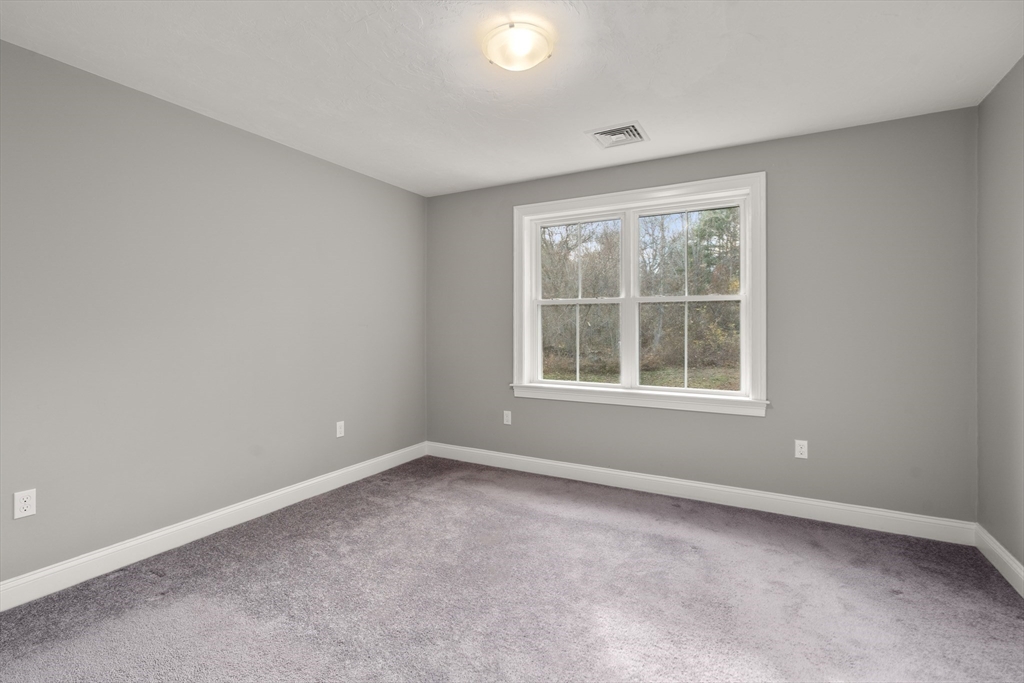 93 Providence Street, Unit B Mendon, MA 01756 - Photo 20 of 38 an empty room with a window