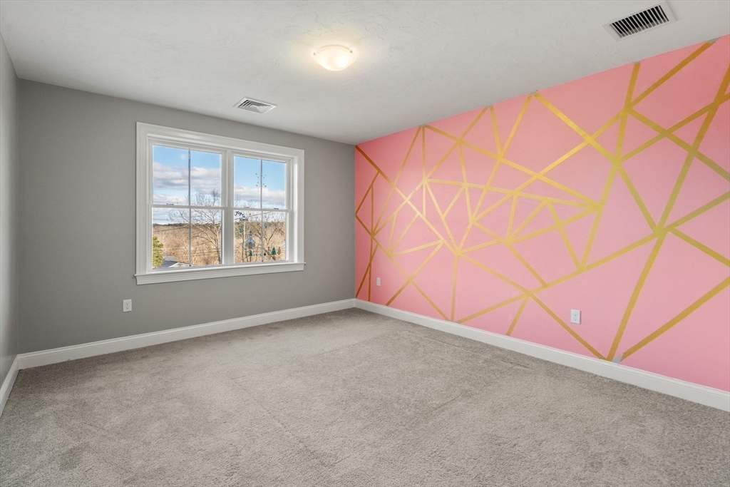 93 Providence Street, Unit B Mendon, MA 01756 - Photo 24 of 38 an empty room with windows