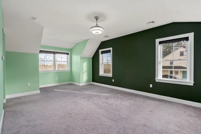 a view of an empty room with a fireplace