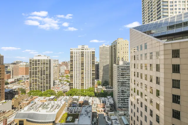 a view of a city with tall buildings