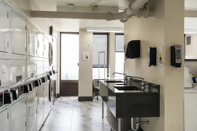 a kitchen with a sink and a stove top oven