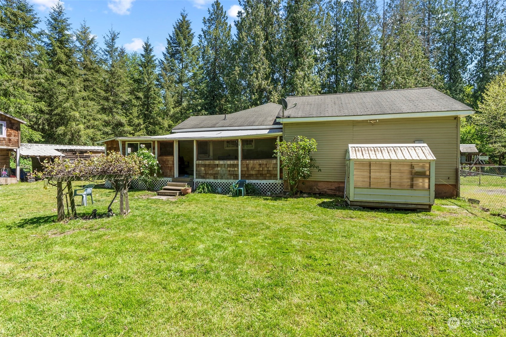 455 Drews Prairie Road Toledo, WA 98591 - Photo 27 of 31 a view of a house with backyard porch and sitting area
