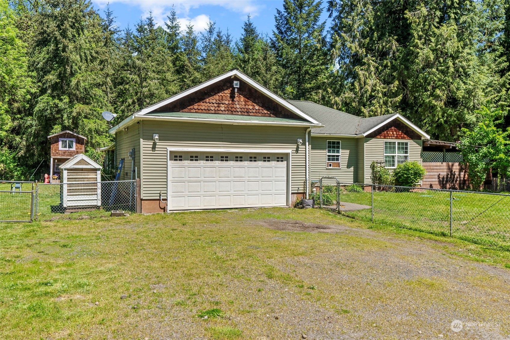 455 Drews Prairie Road Toledo, WA 98591 - Photo 3 of 31 a front view of a house with a yard and garage