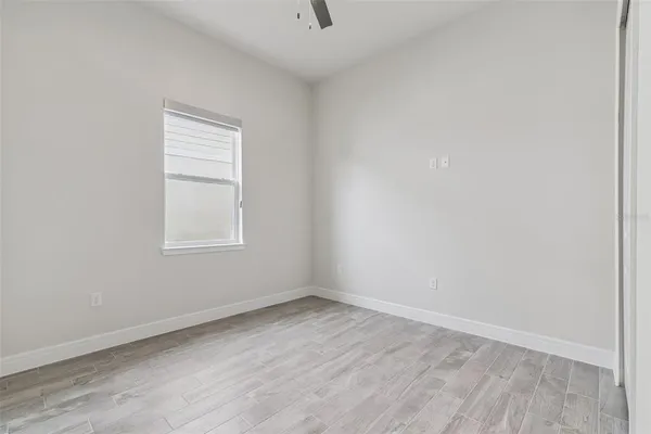 wooden floor & wooden door in an empty room