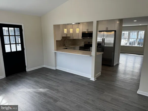a view of a kitchen cabinets and wooden floor