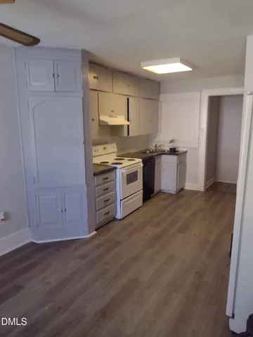 a kitchen with stainless steel appliances granite countertop a stove and a refrigerator