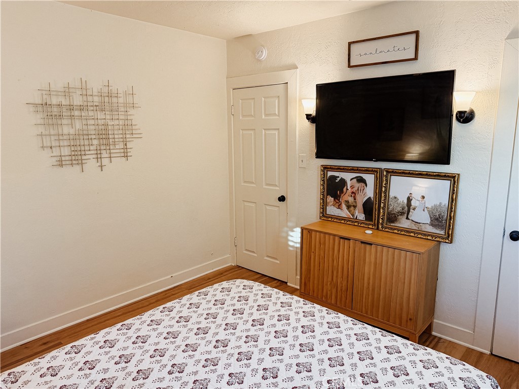 2714 Denton Street Riverside, CA 92507 - Photo 11 of 20 a bedroom with a bed and a flat screen tv