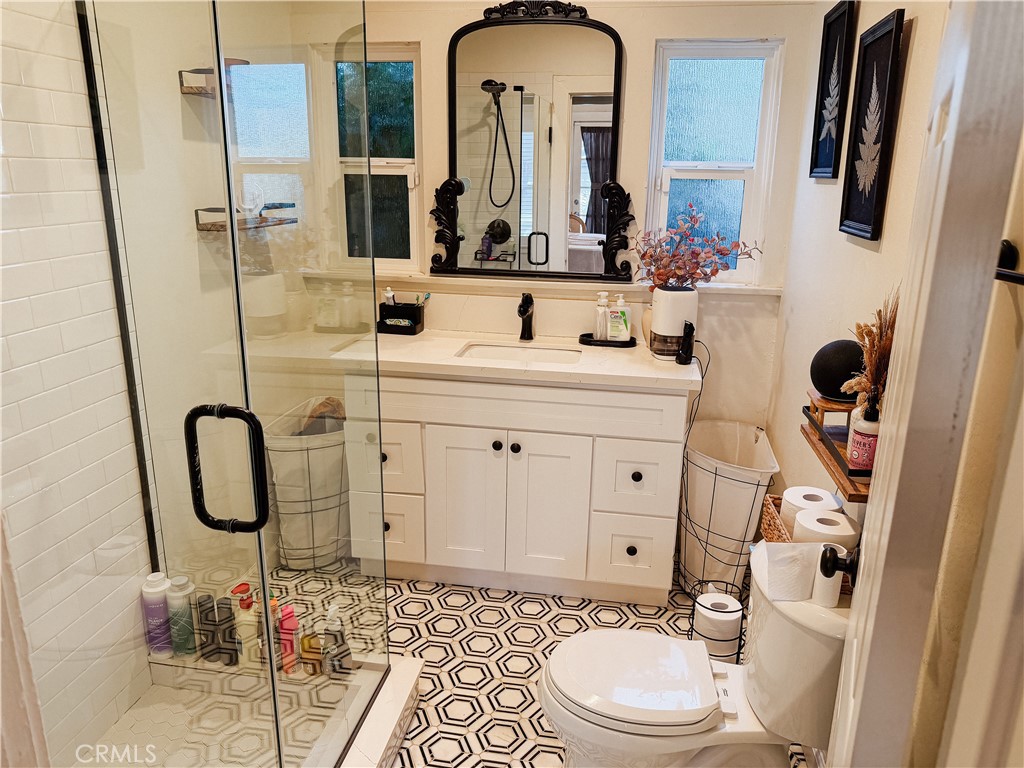 2714 Denton Street Riverside, CA 92507 - Photo 12 of 20 a bathroom with a sink and a mirror