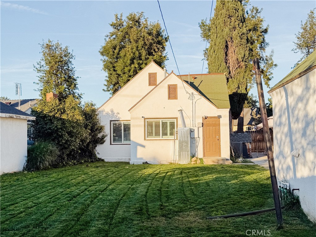 2714 Denton Street Riverside, CA 92507 - Photo 20 of 20 a view of a yard in front of a house with plants and large tree