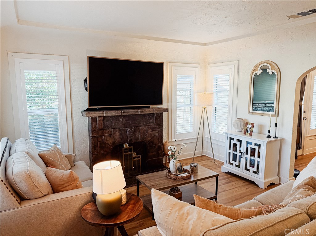 2714 Denton Street Riverside, CA 92507 - Photo 3 of 20 a living room with furniture fireplace and flat screen tv
