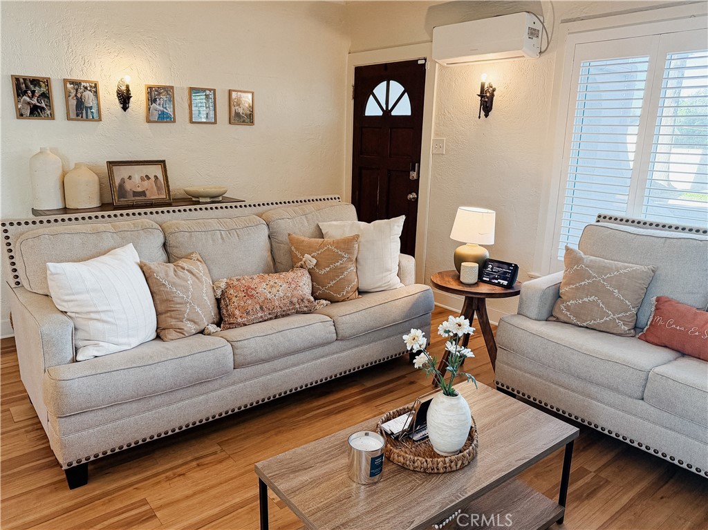 2714 Denton Street Riverside, CA 92507 - Photo 4 of 20 a living room with furniture and wooden floor