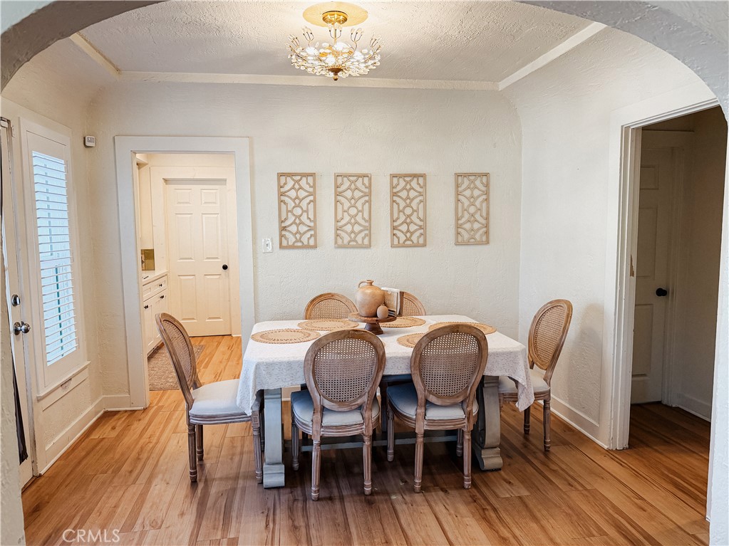 2714 Denton Street Riverside, CA 92507 - Photo 7 of 20 a view of a dining room with furniture and wooden floor