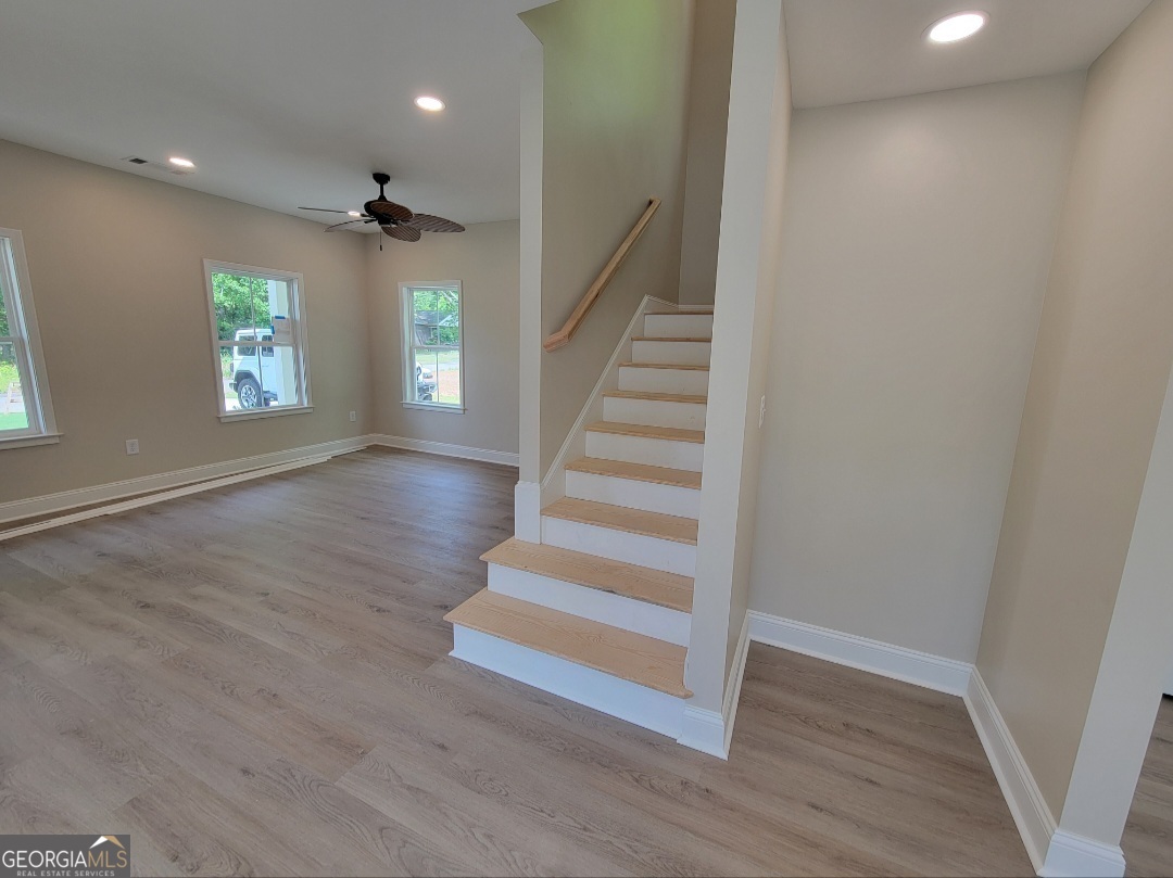 429 Ash Monroe, GA 30655 - Photo 6 of 9 wooden floor in an empty room with a window
