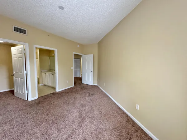an empty room with closet area