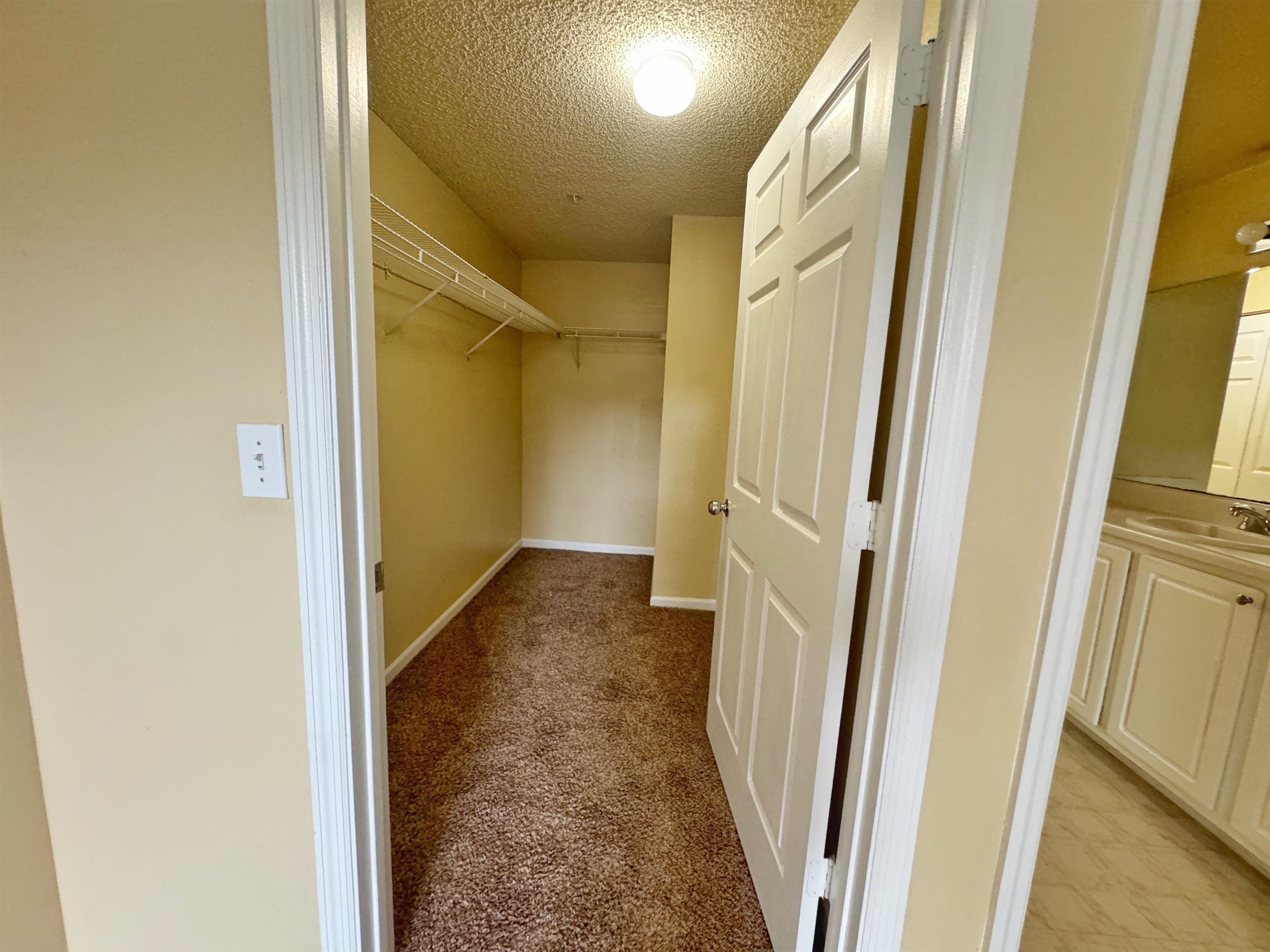 4035 Grande Vista Boulevard, Unit 201 St. Augustine, FL 32084 - Photo 14 of 28 a view of a hallway with wooden floor and entryway