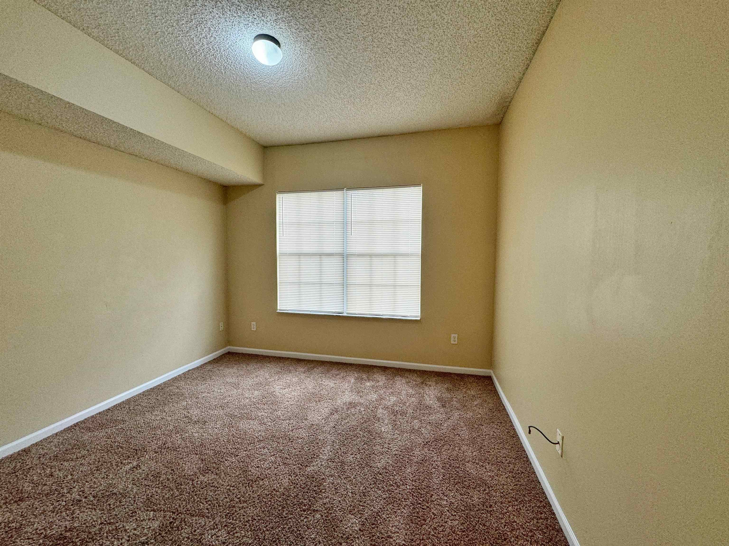 4035 Grande Vista Boulevard, Unit 201 St. Augustine, FL 32084 - Photo 15 of 28 an empty room with a empty space and window