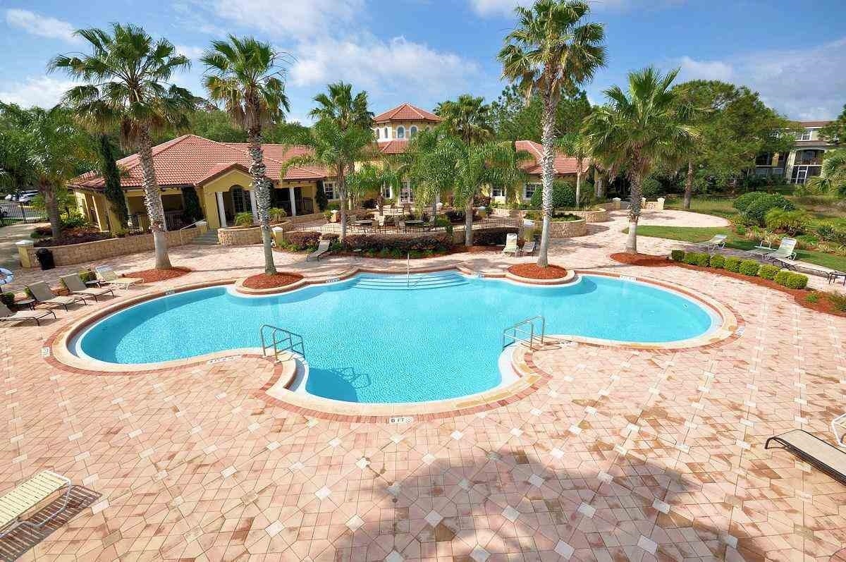 4035 Grande Vista Boulevard, Unit 201 St. Augustine, FL 32084 - Photo 24 of 28 a view of a swimming pool with chairs