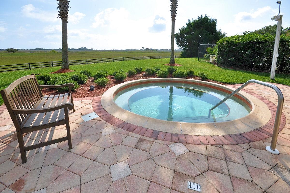 4035 Grande Vista Boulevard, Unit 201 St. Augustine, FL 32084 - Photo 25 of 28 a view of outdoor space yard swimming pool and patio